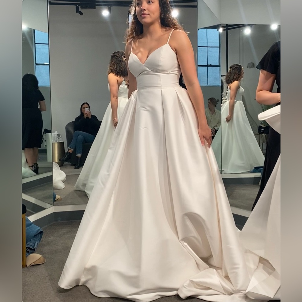 Brand new, made to order and never wore. NO alterations.